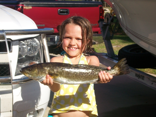 My youngest with her trout.