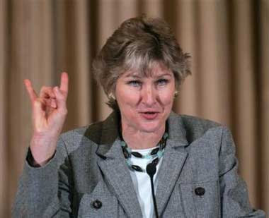 Notice she's making the sign of the devil. When you're this ugly, you'll keep company with anyone.